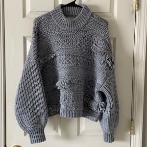 Mock neck fringe pullover sweater